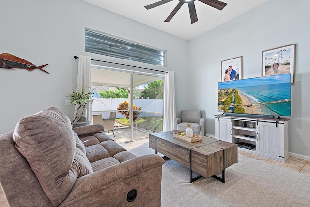 tiled living room featuring ceiling fan