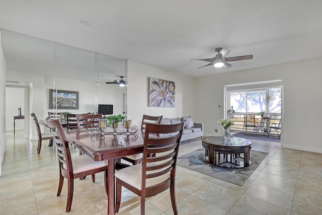 tiled dining room with ceiling fan