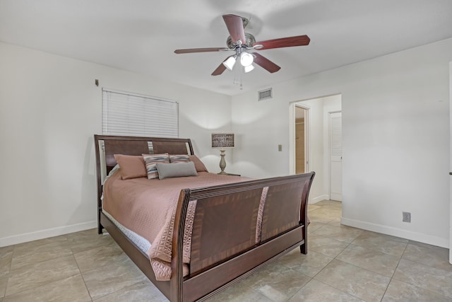 tiled bedroom with ceiling fan