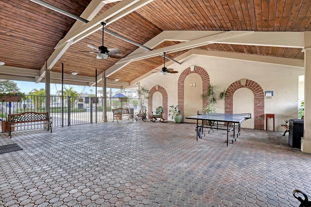 view of patio featuring ceiling fan and a water view