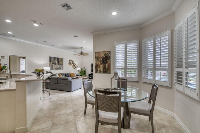 kitchen featuring stainless steel refrigerator with ice dispenser, white cabinetry, crown molding, decorative light fixtures, and decorative backsplash