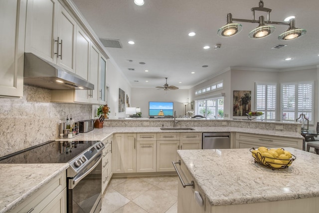 kitchen with under cabinet range hood, stainless steel appliances, visible vents, and a sink