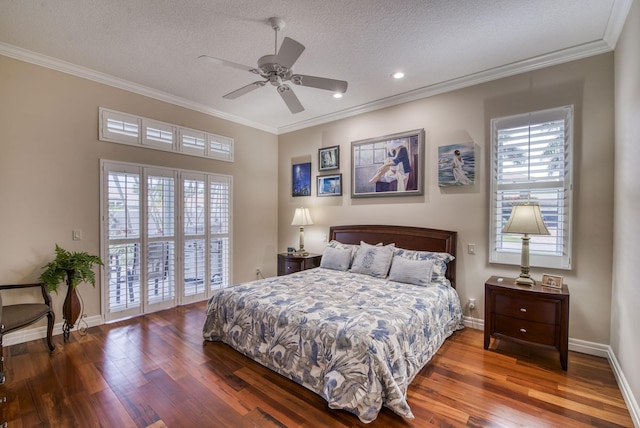 bedroom featuring access to exterior, wood finished floors, baseboards, and ornamental molding