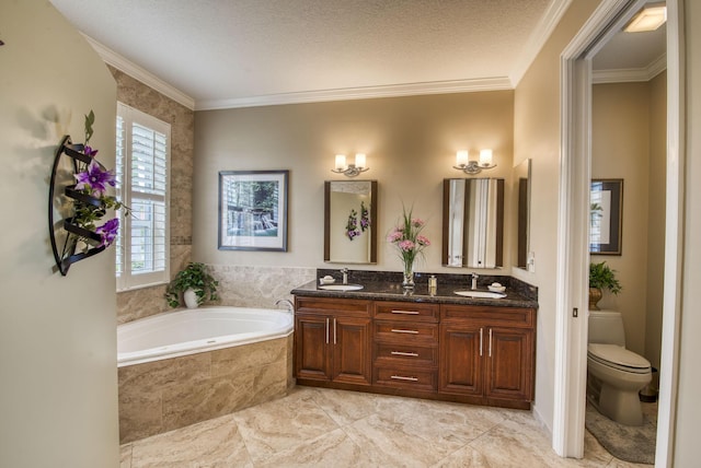 bathroom featuring a sink, a bath, and crown molding