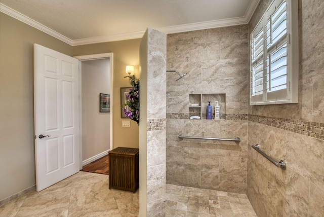 full bath featuring baseboards, crown molding, and a tile shower