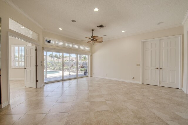 bathroom with a tile shower and crown molding