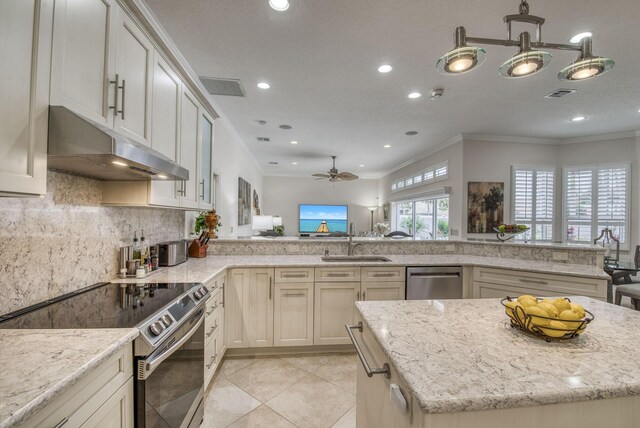 tiled entrance foyer featuring french doors and crown molding