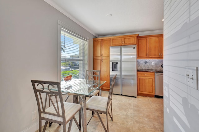 kitchen featuring tasteful backsplash, light tile patterned floors, crown molding, and stainless steel appliances