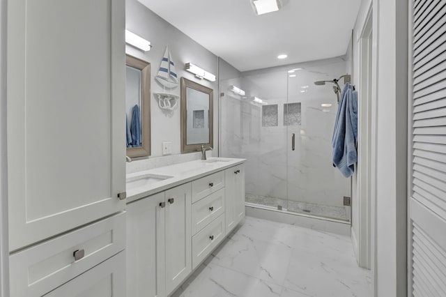 bathroom with an enclosed shower and vanity