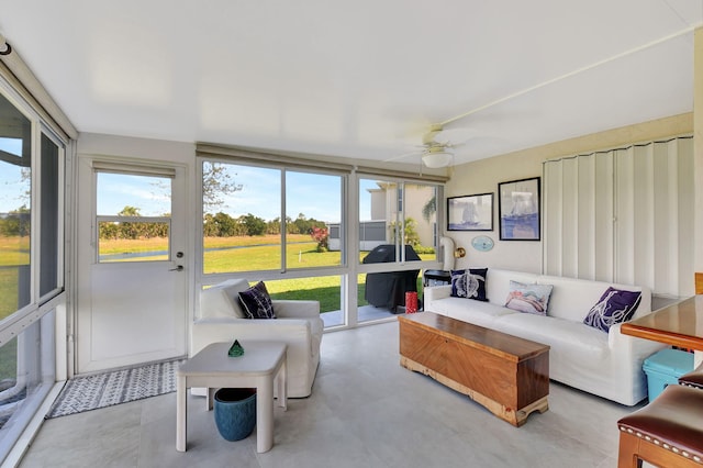 sunroom featuring ceiling fan