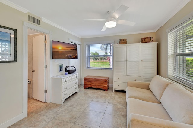 sitting room with light tile patterned floors, crown molding, a wealth of natural light, and ceiling fan