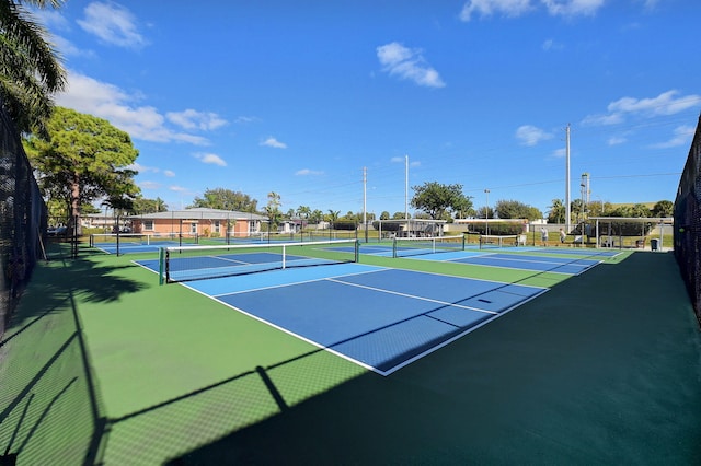 view of sport court featuring basketball hoop