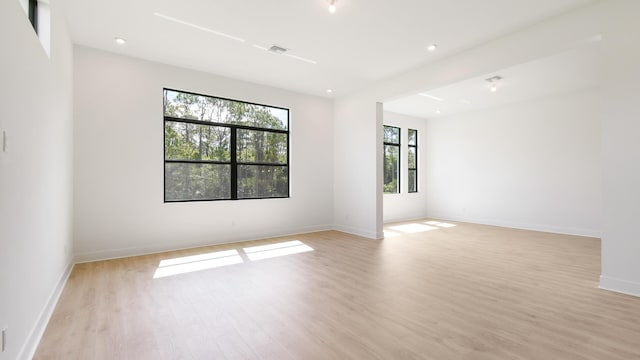 spare room with light hardwood / wood-style flooring