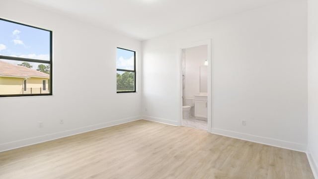 unfurnished room with light hardwood / wood-style floors