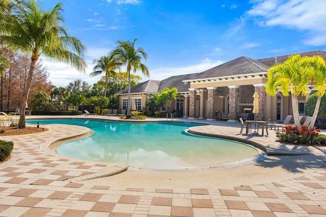 view of swimming pool featuring a patio area