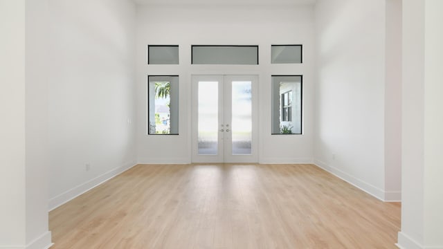 entrance foyer featuring french doors and light wood-type flooring