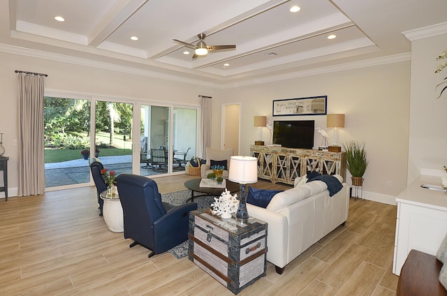 living room featuring beamed ceiling, ornamental molding, and ceiling fan