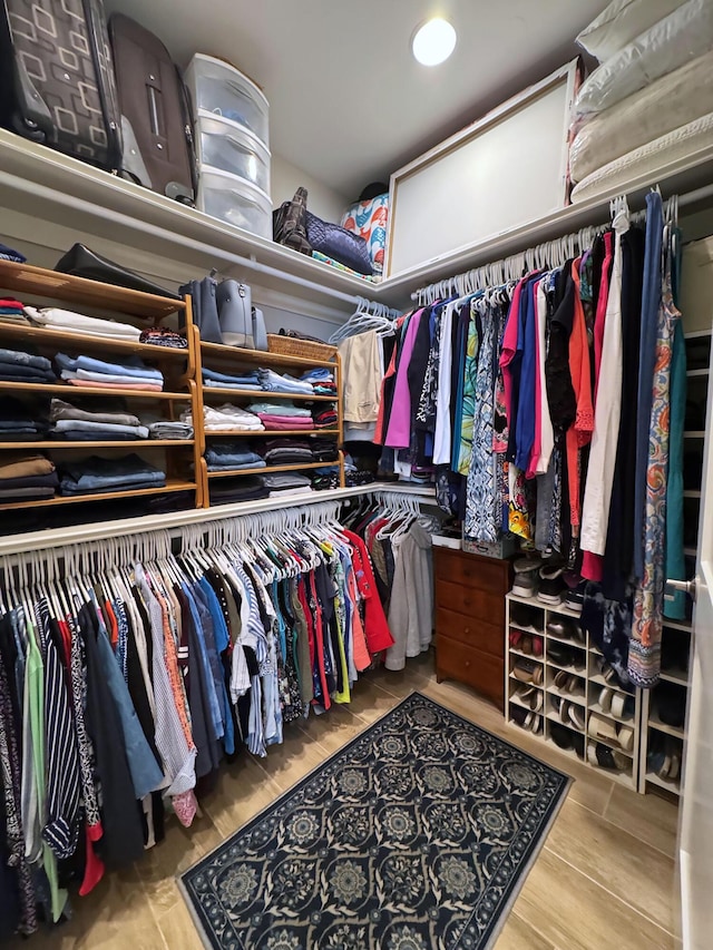 walk in closet featuring light hardwood / wood-style floors