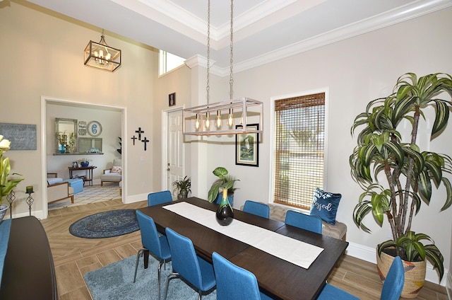 dining area featuring crown molding and an inviting chandelier