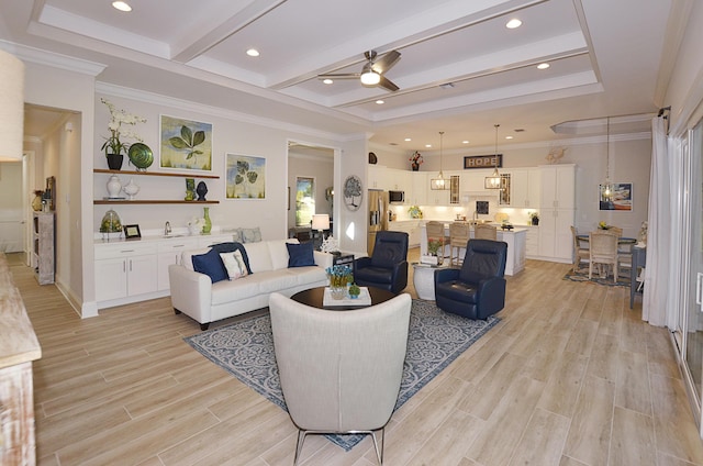 living room with beamed ceiling, ceiling fan, and ornamental molding