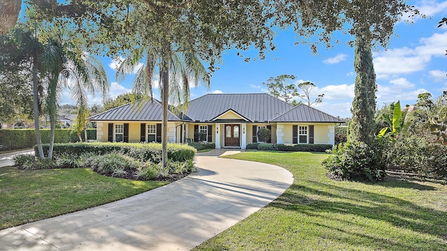 ranch-style home with a front yard