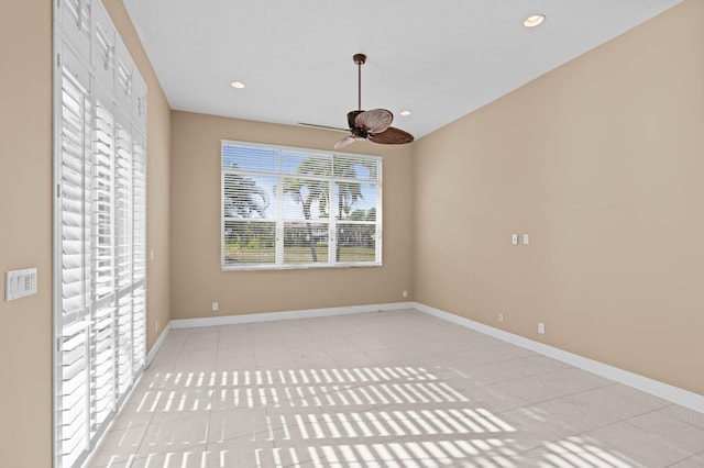 unfurnished dining area featuring light tile patterned flooring and ceiling fan