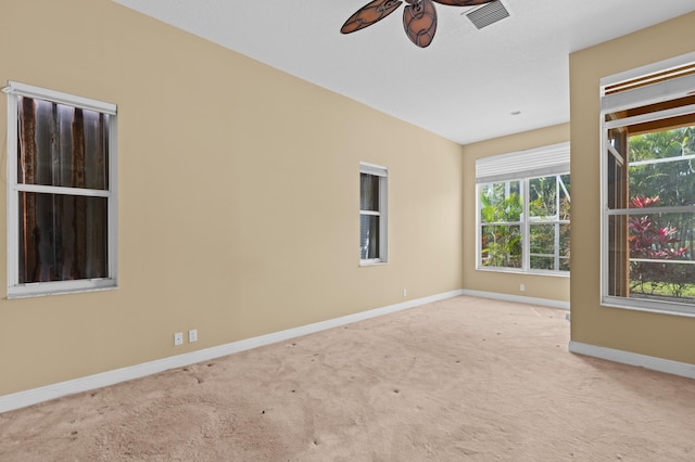 empty room with light colored carpet and ceiling fan