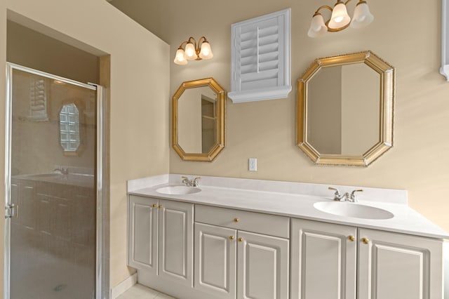 bathroom with vanity and a shower with door