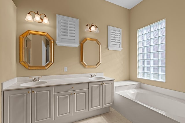 bathroom with vanity, tile patterned floors, and a bathtub