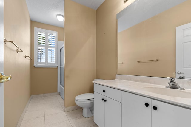 full bathroom with combined bath / shower with glass door, vanity, toilet, tile patterned floors, and a textured ceiling