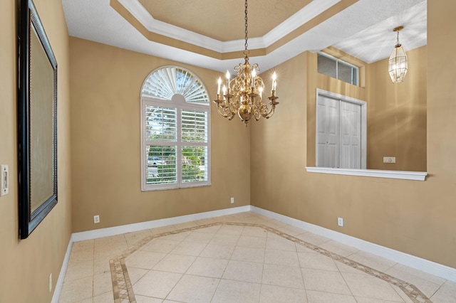 tiled empty room featuring a raised ceiling, crown molding, and a notable chandelier