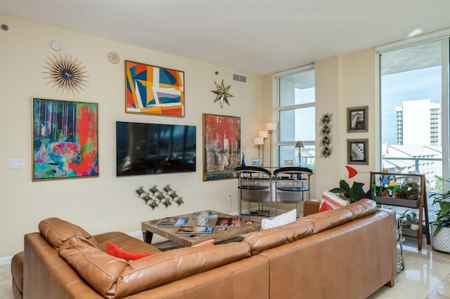 living room with floor to ceiling windows