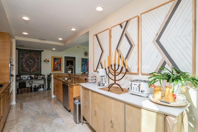 kitchen featuring stainless steel dishwasher and sink