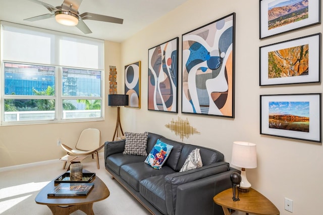 living room featuring carpet flooring and ceiling fan