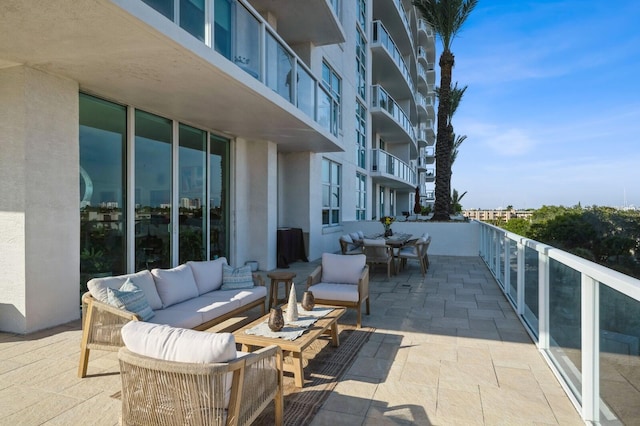 view of patio / terrace featuring a balcony and an outdoor living space