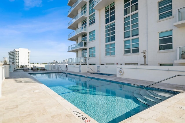 view of pool featuring a patio