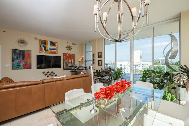 tiled dining space featuring an inviting chandelier and a wall of windows