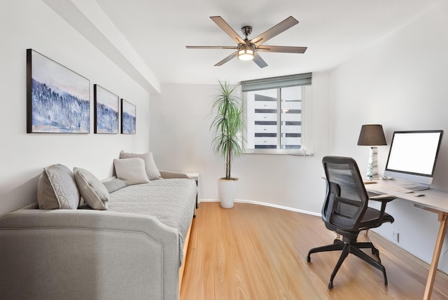 home office with hardwood / wood-style floors and ceiling fan