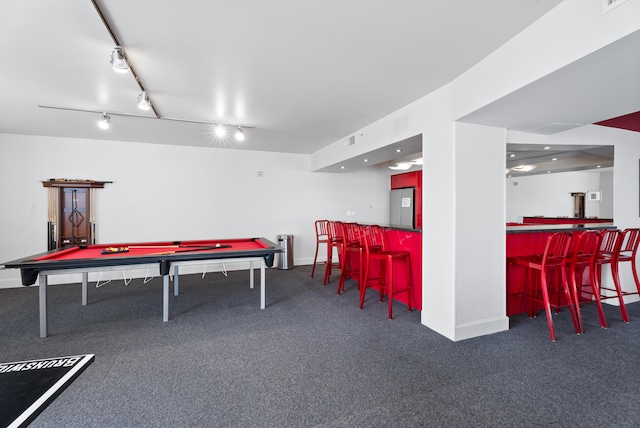 recreation room with indoor bar, pool table, track lighting, and dark colored carpet