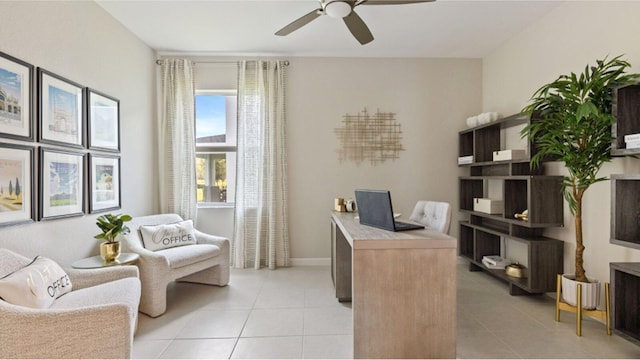 tiled home office featuring ceiling fan