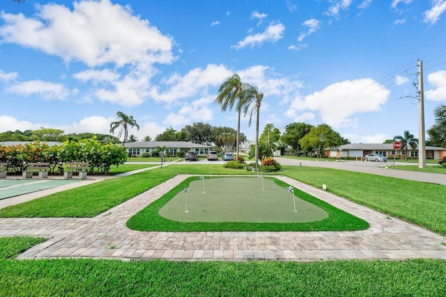 180 High Point Ter E Unit C, Delray Beach, FL 33445 - view of community with a putting area and a yard