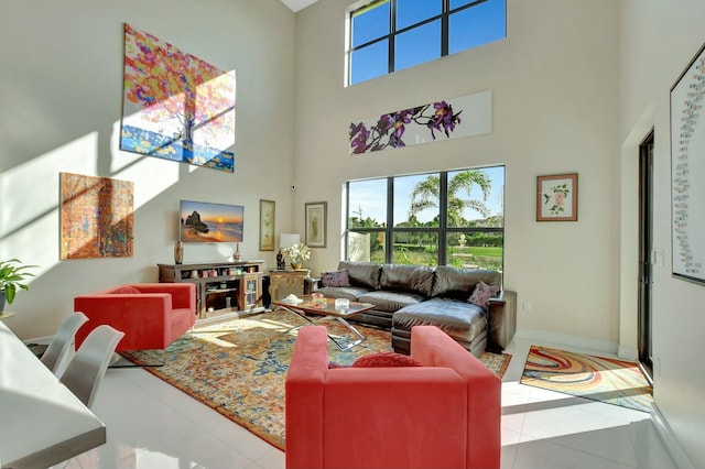 tiled living room featuring a towering ceiling