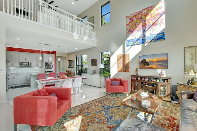 living room featuring a towering ceiling