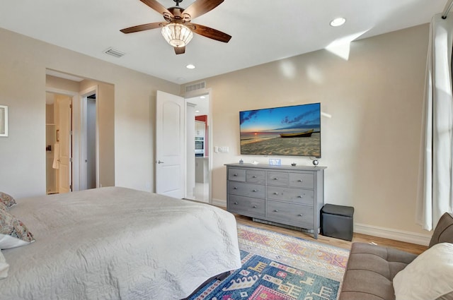 bedroom featuring ceiling fan and light hardwood / wood-style flooring