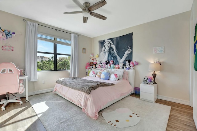 bedroom featuring hardwood / wood-style flooring and ceiling fan