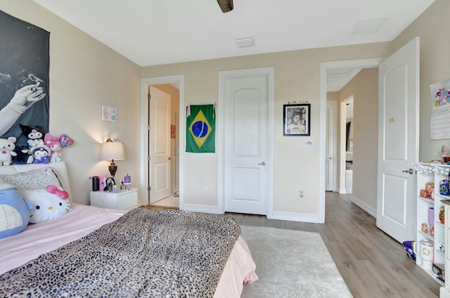 bedroom with light hardwood / wood-style flooring