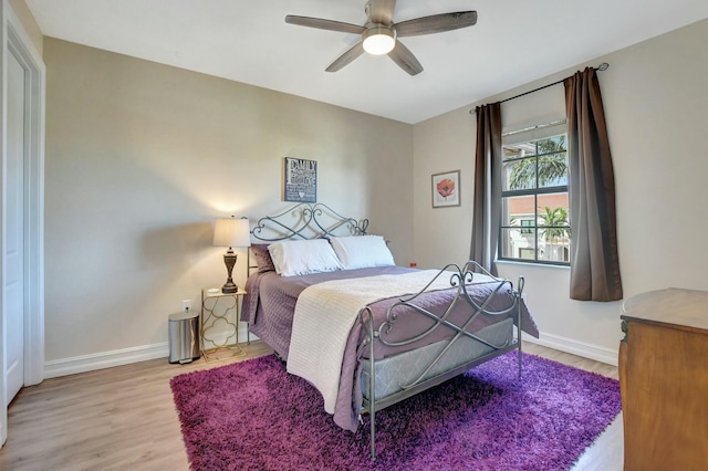 bedroom featuring ceiling fan and light wood-type flooring