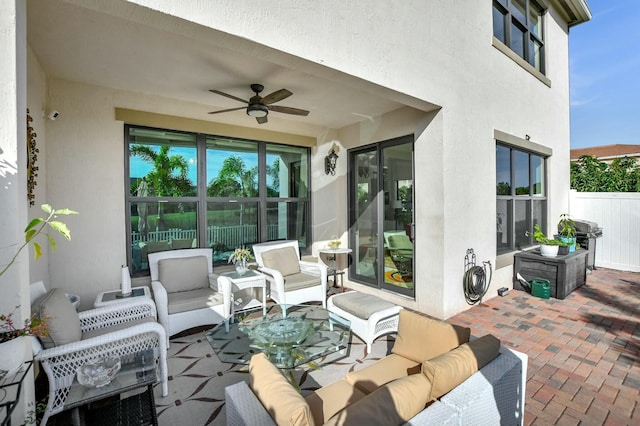 view of patio / terrace with outdoor lounge area, a grill, and ceiling fan