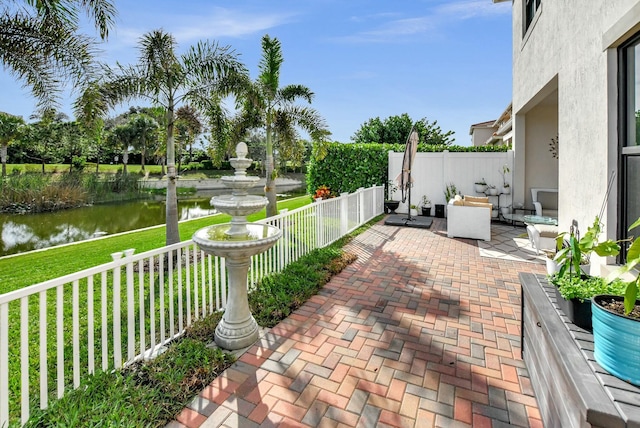 view of patio featuring a water view