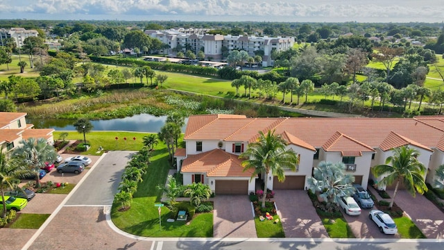 birds eye view of property with a water view